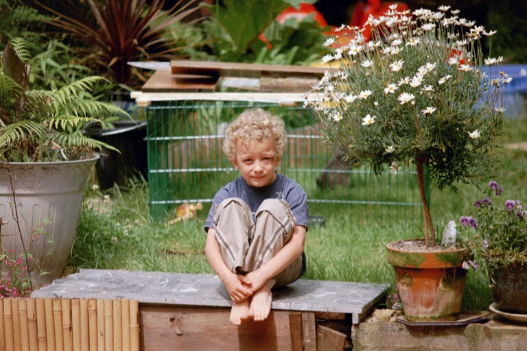 injured eric in garden with fluffy