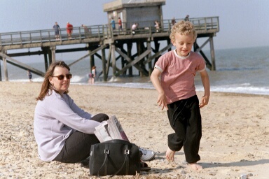 sitting and playing on the hot sand